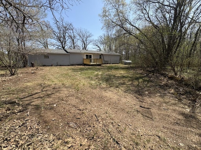 view of yard featuring a wooden deck