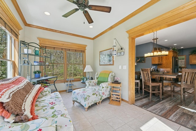 living room with light tile patterned flooring, a ceiling fan, baseboards, recessed lighting, and ornamental molding