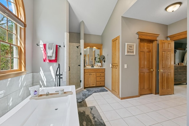 full bath featuring a shower stall, tile patterned flooring, and vanity