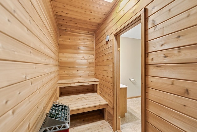 sauna / steam room with wooden walls and wooden ceiling