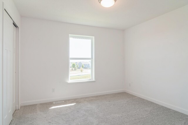 7576 Norway Ln, Lino Lakes, MN 55038 - unfurnished bedroom with carpet flooring, baseboards, and a closet