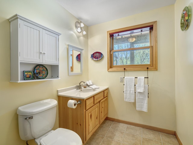 1351 Lone Pine Ln, Garfield Twp, WI 54001 - half bath with baseboards, toilet, vanity, and tile patterned floors