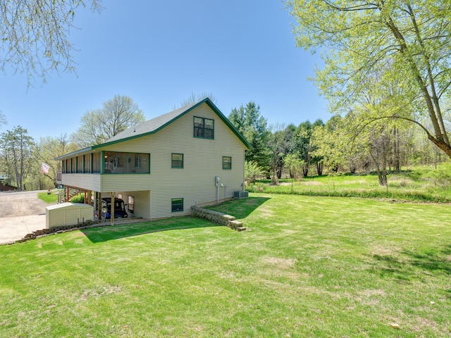 1351 Lone Pine Ln, Garfield Twp, WI 54001 - view of property exterior featuring a sunroom, cooling unit, and a yard