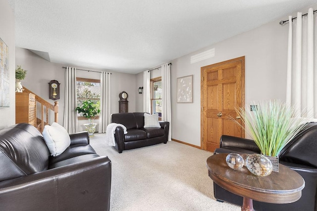 681 4th St NE, Little Falls, MN 56345 - living area with carpet floors, baseboards, and stairs