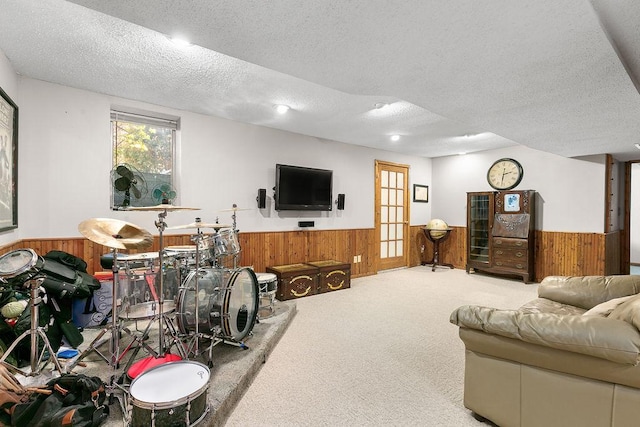 681 4th St NE, Little Falls, MN 56345 - carpeted living area with wainscoting, wood walls, and a textured ceiling