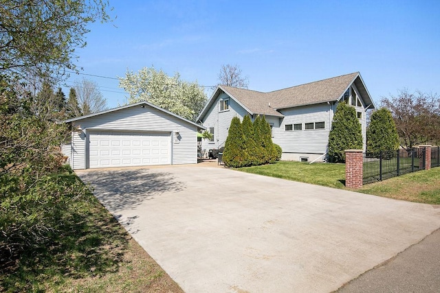 681 4th St NE, Little Falls, MN 56345 - view of front of house featuring an outdoor structure, a detached garage, and roof with shingles