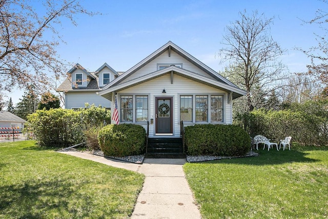681 4th St NE, Little Falls, MN 56345 - bungalow-style home featuring a front yard