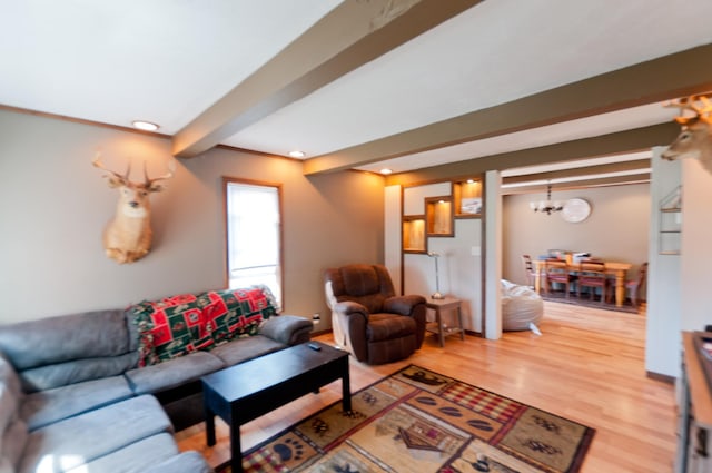 living area featuring a chandelier, wood finished floors, beamed ceiling, and recessed lighting