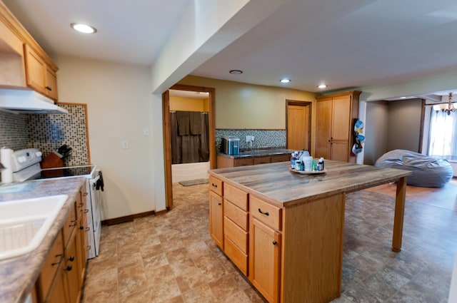 kitchen with electric range, wooden counters, under cabinet range hood, decorative backsplash, and a center island