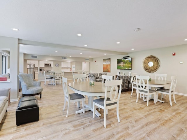 7520 Cahill Rd Unit 222A, Edina, MN 55439 - dining area featuring recessed lighting, light wood-style floors, and baseboards