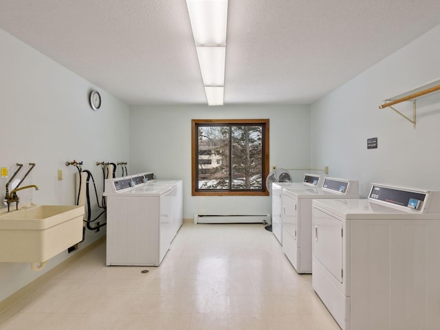 7520 Cahill Rd Unit 222A, Edina, MN 55439 - shared laundry room featuring washer and dryer and baseboard heating