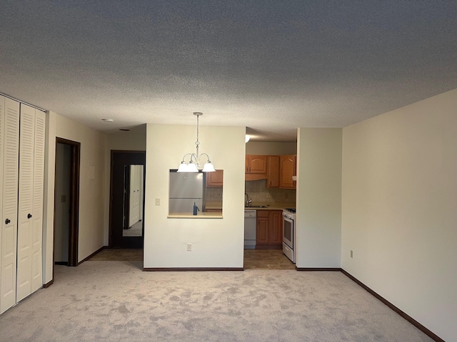 7520 Cahill Rd Unit 222A, Edina, MN 55439 - unfurnished living room with light carpet, baseboards, and a chandelier