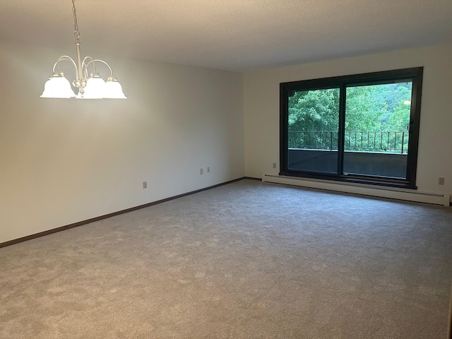 7520 Cahill Rd Unit 222A, Edina, MN 55439 - carpeted spare room featuring a baseboard heating unit, a chandelier, and baseboards