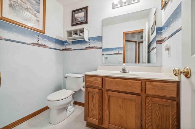 half bathroom featuring toilet, vanity, and baseboards