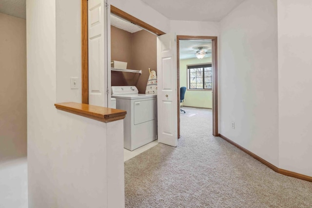 washroom featuring light carpet and baseboards