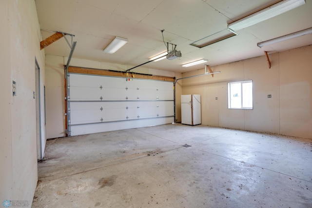 10544 40th St N, Kragnes Twp, MN 56560 - garage with freestanding refrigerator and a garage door opener