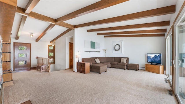 carpeted living room with beam ceiling and baseboard heating