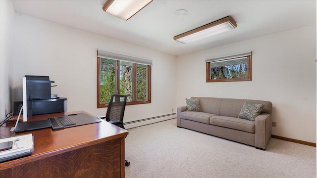 carpeted office with a baseboard radiator and baseboards