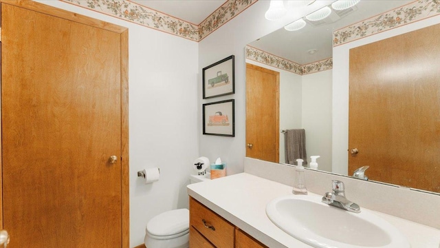 half bath with toilet and vanity