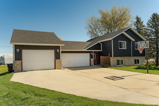 192 Harrison Ave SE, Racine, MN 55967 - tri-level home featuring a garage, driveway, brick siding, and a front yard