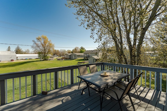 192 Harrison Ave SE, Racine, MN 55967 - wooden deck featuring outdoor dining area and a yard