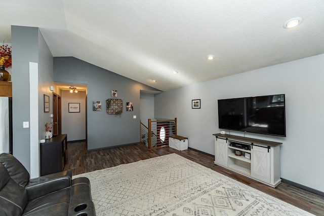 192 Harrison Ave SE, Racine, MN 55967 - living area with vaulted ceiling, dark wood finished floors, and baseboards