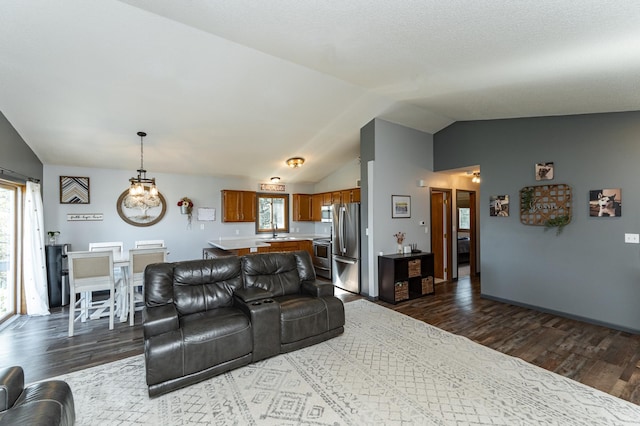 192 Harrison Ave SE, Racine, MN 55967 - living area featuring vaulted ceiling and dark wood-style floors