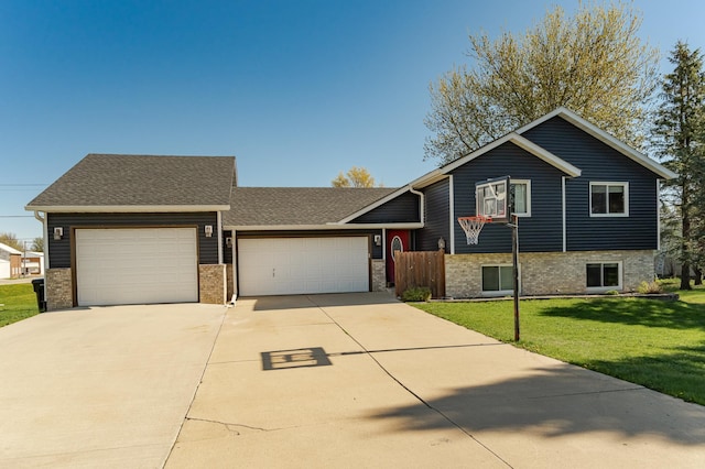 192 Harrison Ave SE, Racine, MN 55967 - split level home featuring brick siding, a garage, driveway, and a shingled roof