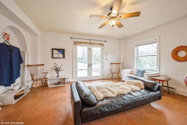 79 Western Ave N Unit 206, Saint Paul, MN 55102 - living room with concrete floors, ceiling fan, french doors, and a baseboard heating unit
