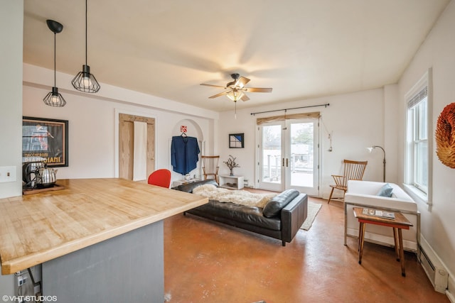 79 Western Ave N Unit 206, Saint Paul, MN 55102 - living room featuring french doors, concrete floors, ceiling fan, and a baseboard heating unit