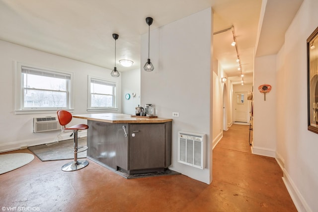 79 Western Ave N Unit 206, Saint Paul, MN 55102 - bar area with concrete floors, track lighting, a wall mounted air conditioner, baseboards, and decorative light fixtures