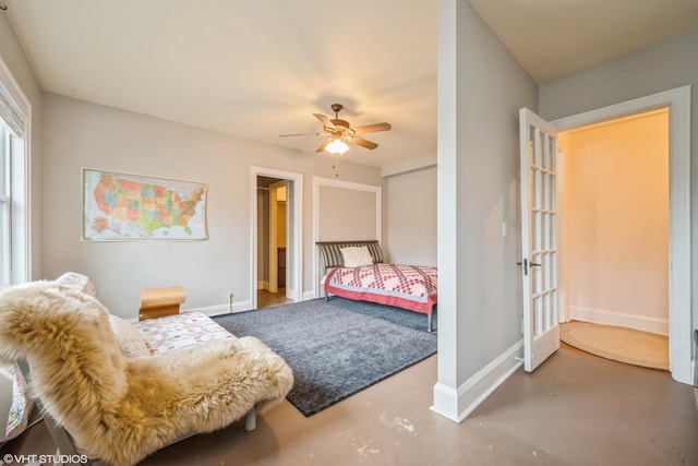 79 Western Ave N Unit 206, Saint Paul, MN 55102 - bedroom featuring concrete floors, baseboards, and a ceiling fan