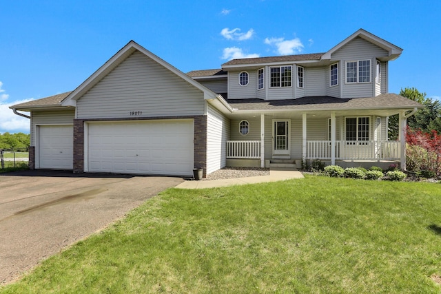 18071 Lincoln Cir NW, Elk River, MN 55330 - traditional home with a garage, driveway, a front lawn, a porch, and roof with shingles