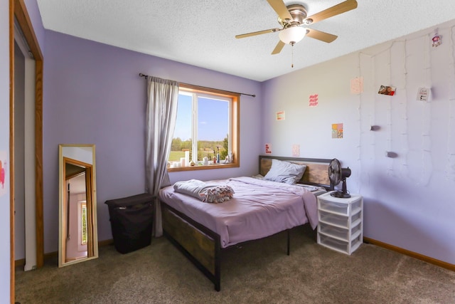 18071 Lincoln Cir NW, Elk River, MN 55330 - bedroom with carpet floors, a textured ceiling, ceiling fan, and baseboards