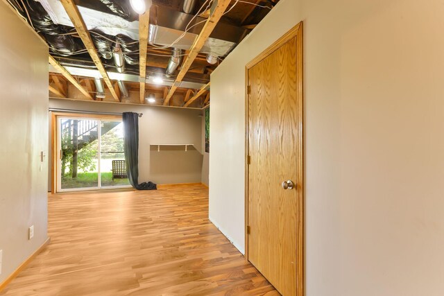 18071 Lincoln Cir NW, Elk River, MN 55330 - hall with light wood-style flooring and baseboards