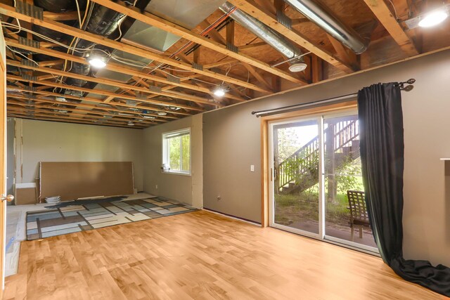 18071 Lincoln Cir NW, Elk River, MN 55330 - unfurnished living room with wood finished floors