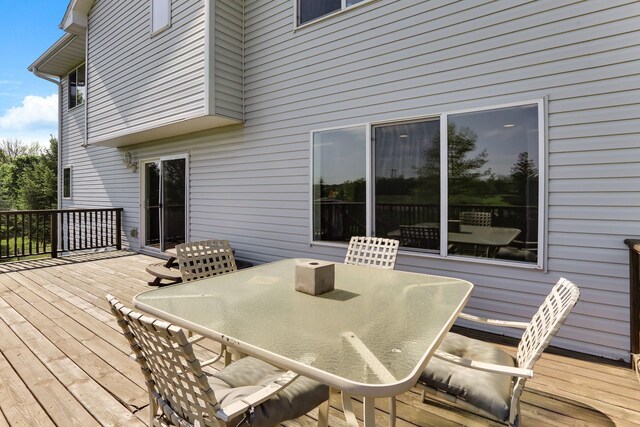 18071 Lincoln Cir NW, Elk River, MN 55330 - wooden deck with outdoor dining area