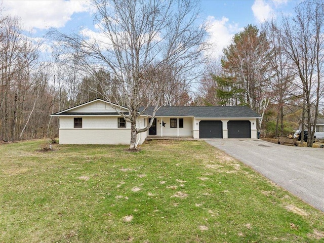 ranch-style home with a front lawn, aphalt driveway, and a garage