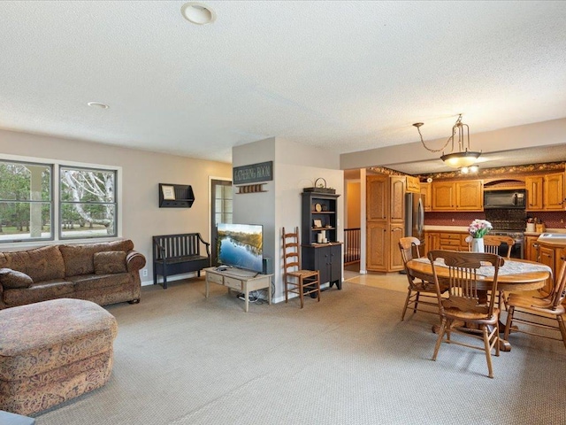 19531 Pine Landing Dr, Grand Rapids, MN 55744 - dining room with light carpet and a textured ceiling