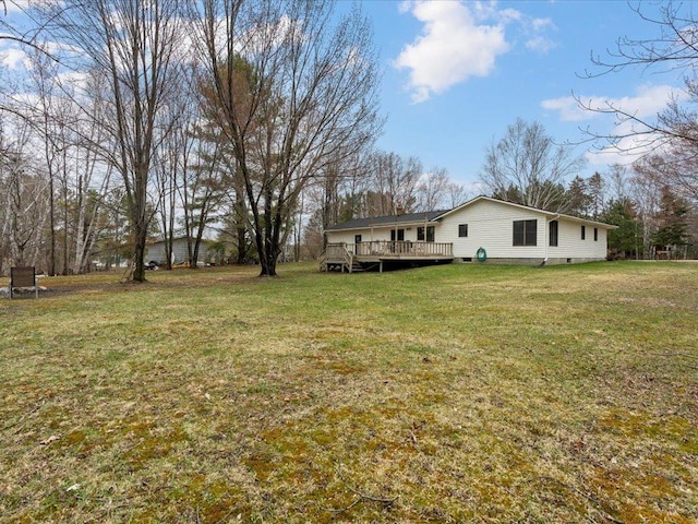 19531 Pine Landing Dr, Grand Rapids, MN 55744 - view of grassy yard with a wooden deck