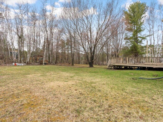 19531 Pine Landing Dr, Grand Rapids, MN 55744 - view of grassy yard featuring a wooden deck