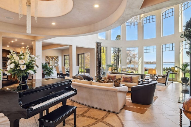 1860 Shoreline Dr, Orono, MN 55391 - living room featuring recessed lighting, light tile patterned floors, a water view, and a towering ceiling