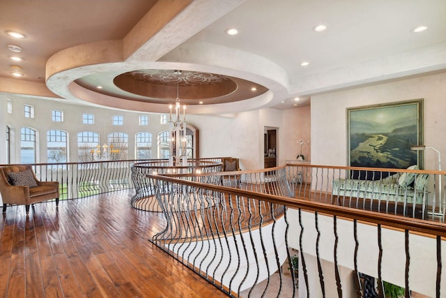 1860 Shoreline Dr, Orono, MN 55391 - corridor with a chandelier, a raised ceiling, hardwood / wood-style floors, an upstairs landing, and recessed lighting