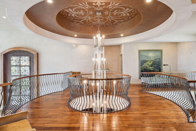 1860 Shoreline Dr, Orono, MN 55391 - detailed view of a chandelier, wood finished floors, a tray ceiling, and recessed lighting