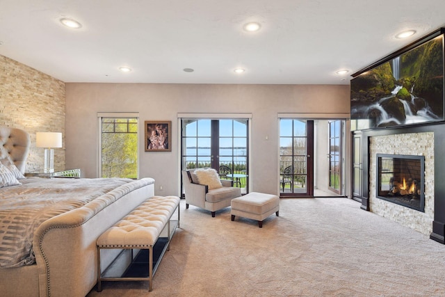 1860 Shoreline Dr, Orono, MN 55391 - bedroom featuring carpet flooring, access to outside, recessed lighting, and a fireplace