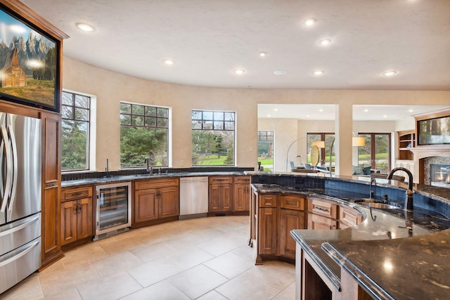 1860 Shoreline Dr, Orono, MN 55391 - kitchen featuring wine cooler, stainless steel appliances, brown cabinetry, recessed lighting, and a sink