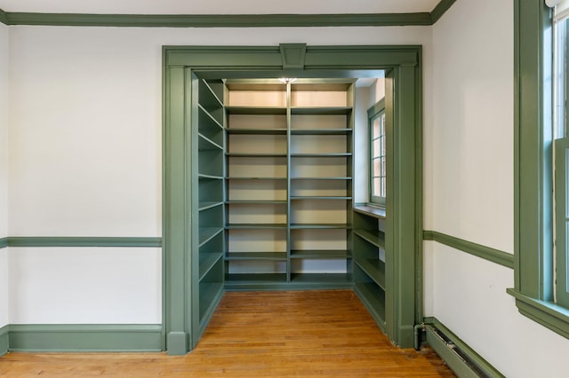 storage area featuring baseboard heating