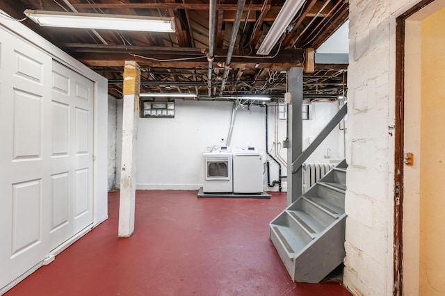 unfinished below grade area with washing machine and dryer, radiator heating unit, and stairway