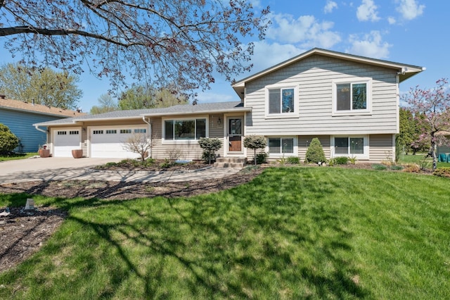 tri-level home with an attached garage, concrete driveway, a front yard, and entry steps