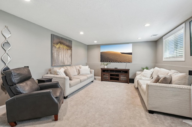 living area with carpet floors and recessed lighting
